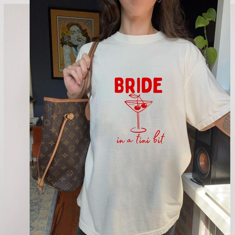 Bride in a Tini Bit Graphic T-shirt, Trendy Bachelorette Party Shirt, Gift for Bride, Wedding Day Clothing, Bride Apparel, Martini