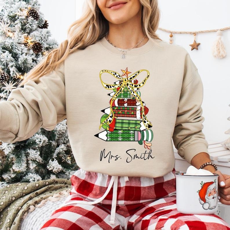 Coquette Bow Pencil Teacher Christmas Shirt, Custom Name Teacher Sweatshirt, Very Merry Teacher T-shirt, Santa's Favorite Teacher Tee