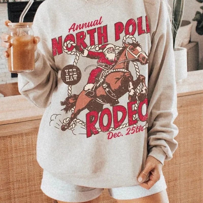 North Pole Rodeo Sweatshirt UNISEX Cowboy Santa Crewneck Country Christmas Shirt Western Santa Claus PJ Groovy Festive Vintage Santa Rodeo