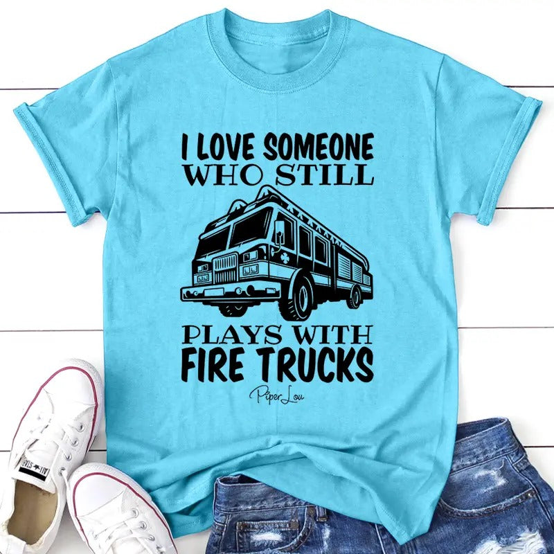 I Love Someone Who Still Plays With Firetrucks Apparel, Printed In The USA, Tee / Tank / V Neck Gray / White / Blue / Hot Pink / Orange, #sassy #cute #blackprint
