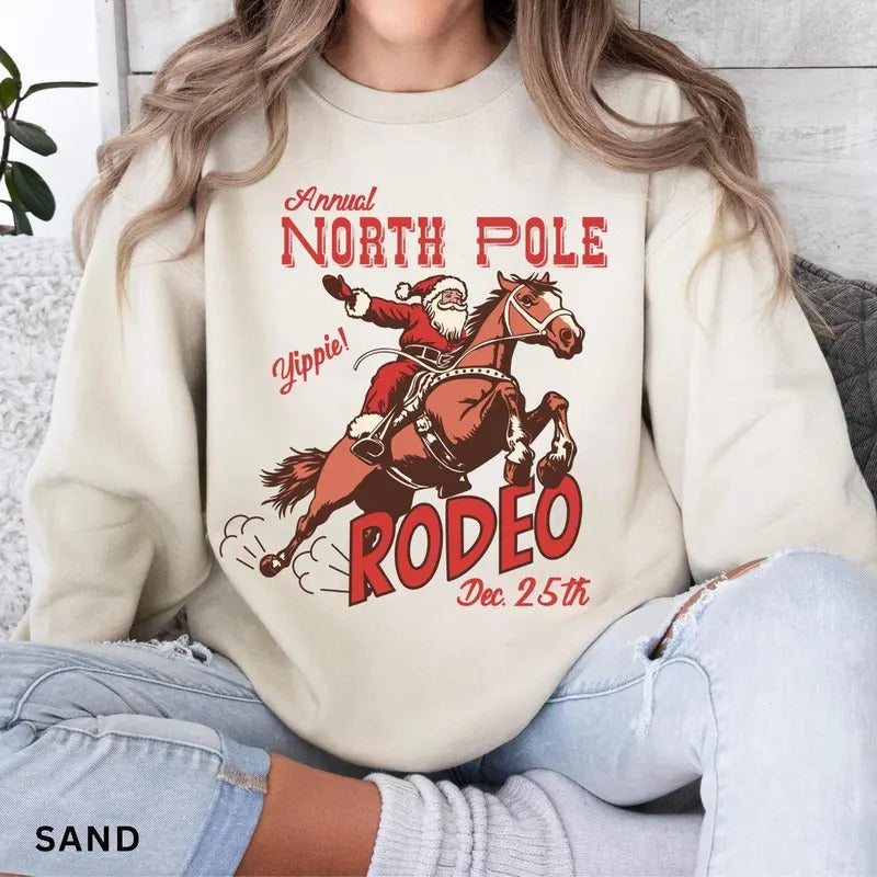 Retro Western Christmas Sweatshirt, North Pole Rodeo Sweatshirt, Trendy Western Holiday Shirt, Cute Country Christmas Shirt, Cowboy Santa Christmas Gift Idea 2024, Gift For Him, Gift For Her