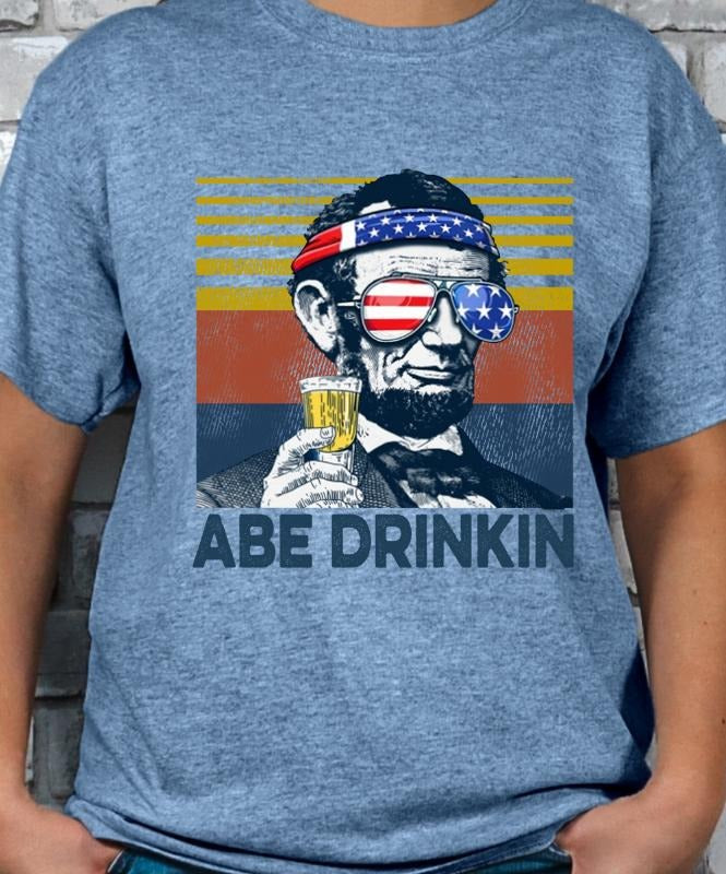 Abe Drinkin T-shirt - Casual Crewneck with Graphic Design Featuring Abe Lincoln and Beer Bottle, Ideal for Men's Streetwear