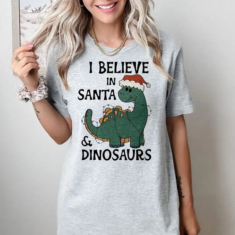 I believe in Santa and Dinosaurs - T-Shirt -  Print is Sublimation, Unisex T-Shirt, Funny Tee,Gift Idea, Womenswear Graphic Top Cute