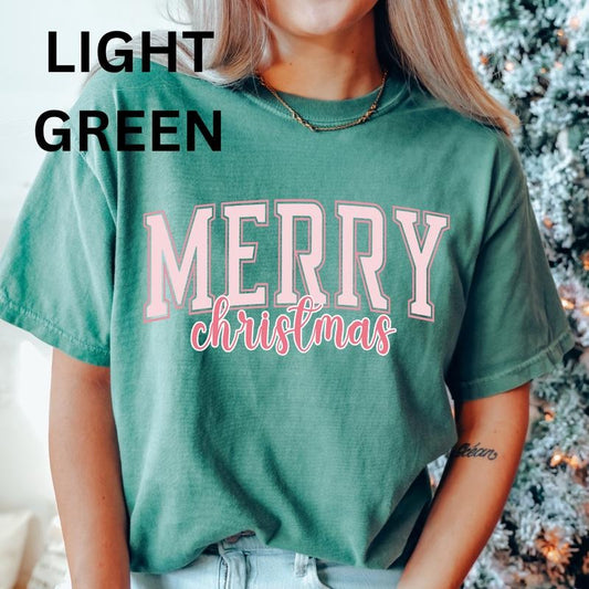 Merry Christmas Pink Varsity Shirt, Christmas Shirt, Christmas Coquette Bow (COMFORT COLORS T-SHIRT, CASUAL SHIRT UNISEX, CHRISTMAS CLOTHING, GRAPHIC APPAREL, HOLIDAY SHIRT) Cotton Fabric Womenswear Top Printed Oversized Women
