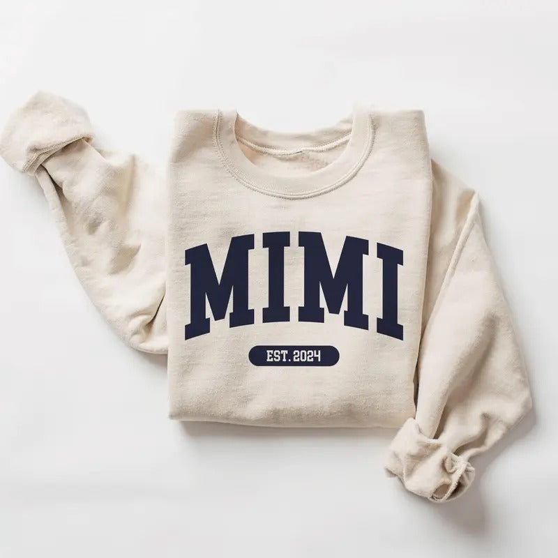 Mimi Varsity Xmas Sweatshirt, Mimi EST 2024 - New Mimi To Be Gift - Pregnancy Reveal - Unisex Crewneck Sweatshirt Classic Cotton Fabric Menswear