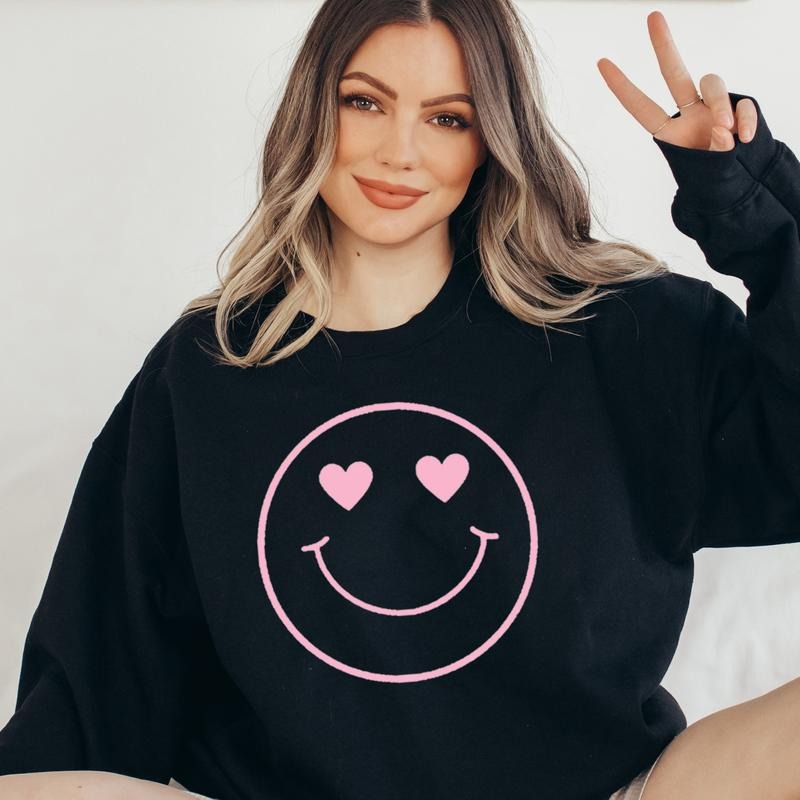 Pink heart smiley eyes sweatshirt Valentines Smiles Sweatshirt Pink Valentines Sweater Heart Smile Sweatshirt Oversized Fit Sweater Comfy Soft Sweatshirt Gift for Girlfriend Sweater Casual Cute Womenswear Comfortable Day Hoodie Tops  Lady Pullover